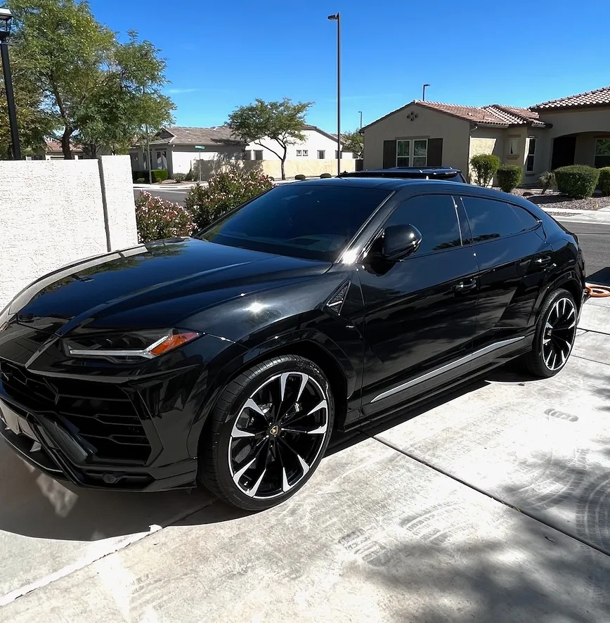 Black Lamborghini profile after a full detail