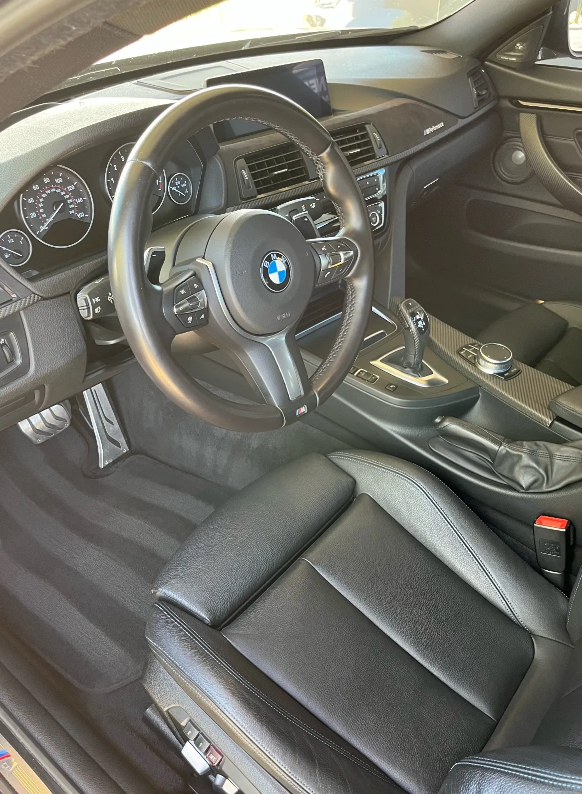 Fully detailed car interior with clean seats, dash, and carpets