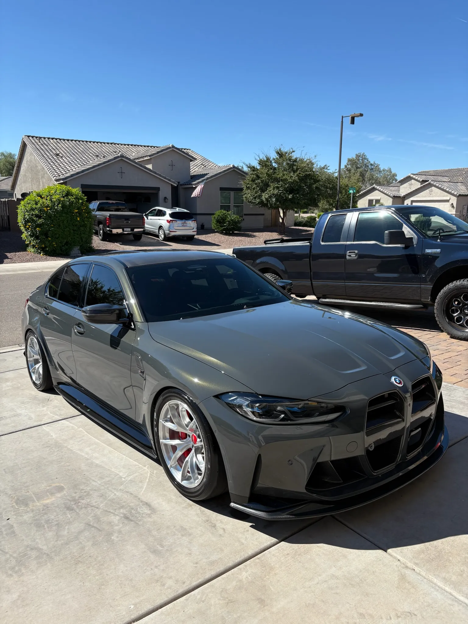 Detailed gray BMW parked in a shared lot