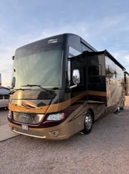 RV roof edge and awning being cleaned during a mobile detail