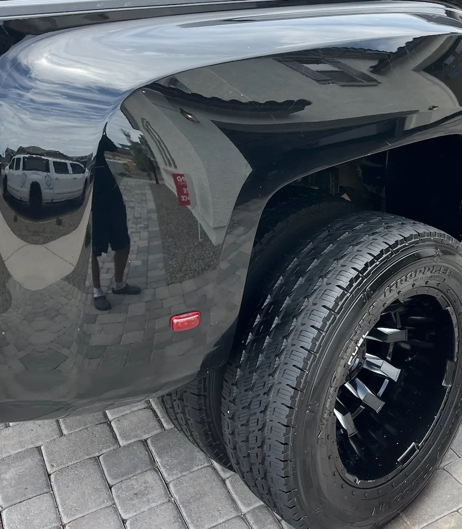 The same truck wheel and tire cleaned and dressed after detailing